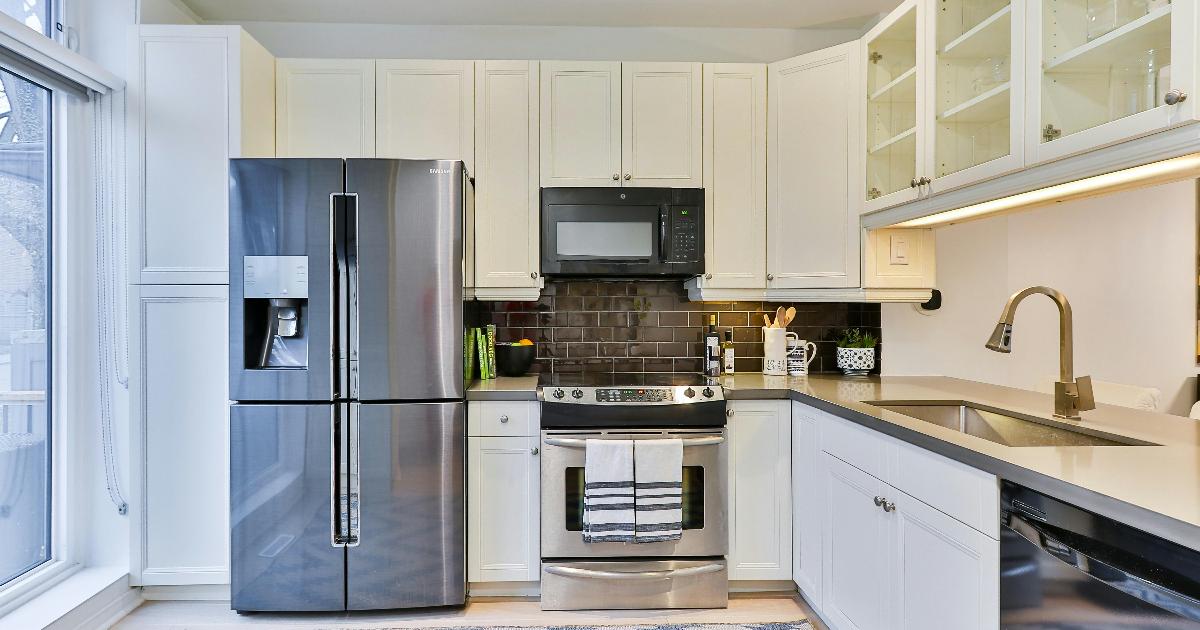 A broken kitchen appliance beside a simple repair or replace checklist for smart money decisions