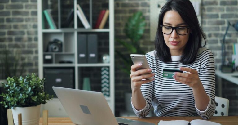 A person reviewing bank statements to spot everyday spending leaks and recurring charges